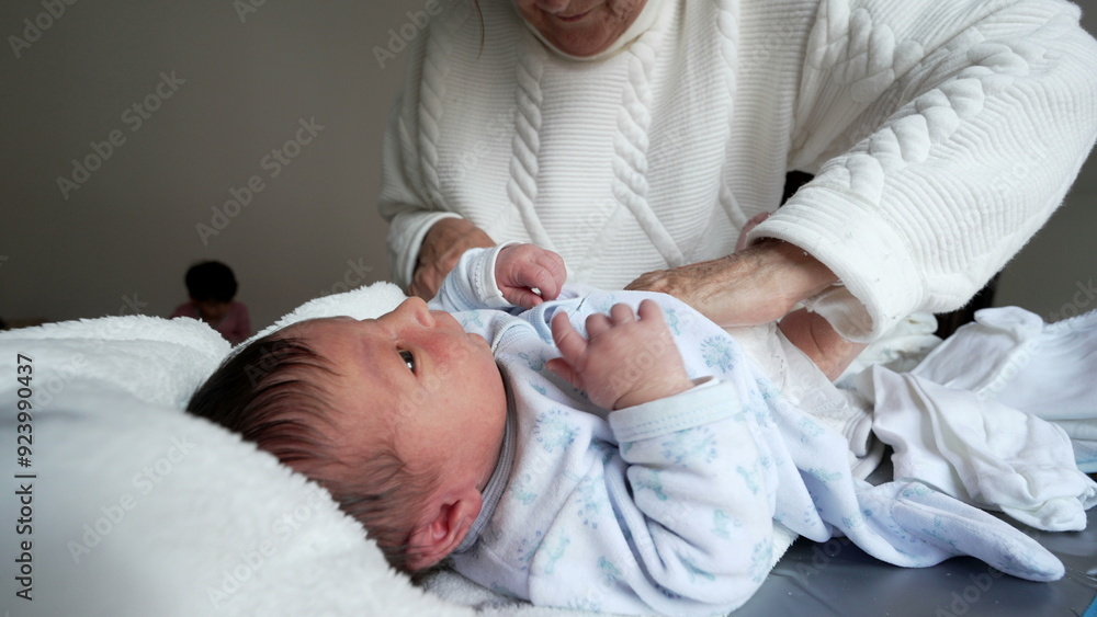Grandmother changing baby's diaper, nurturing and caring scene, infant lying down, family bonding moment, hands-on parenting, cozy and intimate home environment Grandmother changing baby's diaper, nurturing and caring scene, infant lying down, family bonding moment, hands-on parenting, cozy and intimate home environment
