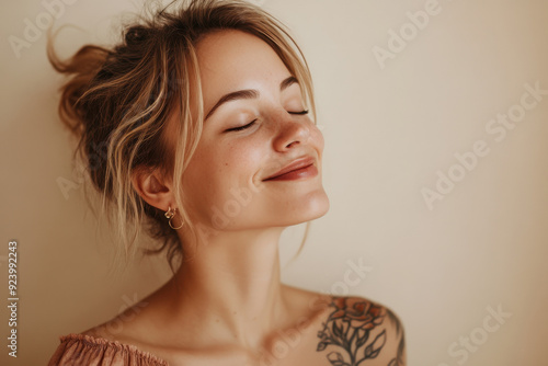 Wallpaper Mural A close up of a woman's face with tattoos and her eyes closed Torontodigital.ca