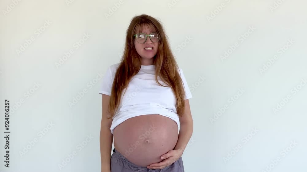 Sad frustrated pregnant woman on white background Sad frustrated pregnant woman on white background