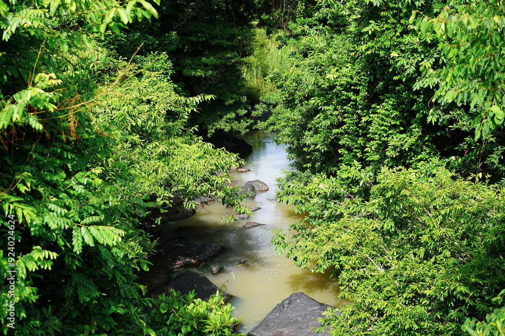 Scenery of waterfall and big rocks among green nature with trees.Waterfall in the forest, view in Tat Ton Waterfall at Tat Ton National Park, Chaiyaphum, Thailand. Scenery of waterfall and big rocks among green nature with trees.Waterfall in the forest, view in Tat Ton Waterfall at Tat Ton National Park, Chaiyaphum, Thailand.