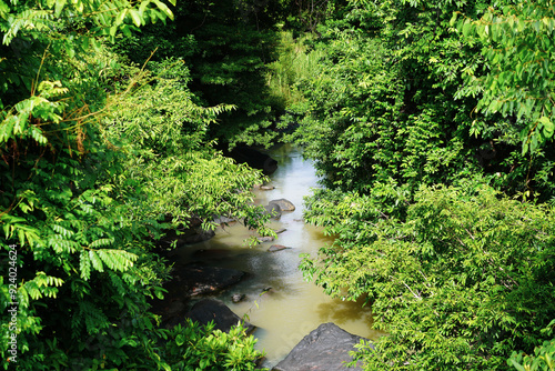 Scenery of waterfall and big rocks among green nature with trees.Waterfall in the forest, view in Tat Ton Waterfall at Tat Ton National Park, Chaiyaphum, Thailand.