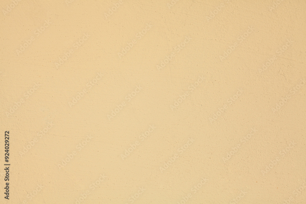 Beige or light-brown wall, texture, background. The building wall, painted with water-based paint. Pale (flat) surface in creme color. Beige, smooth backdrop with a little unevenness and abrasions Beige or light-brown wall, texture, background. The building wall, painted with water-based paint. Pale (flat) surface in creme color. Beige, smooth backdrop with a little unevenness and abrasions