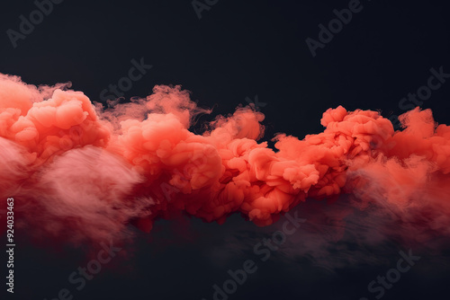 A dramatic burst of red smoke expands against a solid black background, creating a striking contrast. The swirling, cloud like formation captures the dynamic motion and intensity of the explosion. photo