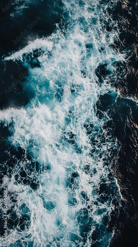A close-up view of a dark blue ocean wave featuring white frothy crests and turbulent water, showcasing the beauty and power of the sea A close-up view of a dark blue ocean wave featuring white frothy crests and turbulent water, showcasing the beauty and power of the sea