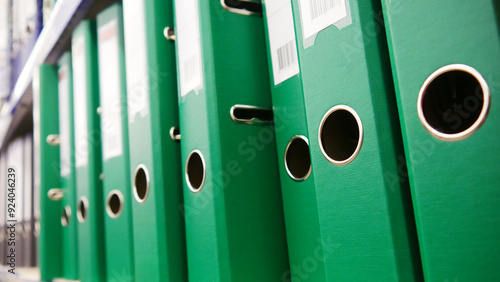 Fotografie Close-up of many green archive folders standing in a row