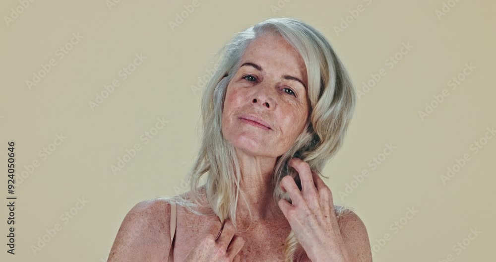 Face, skincare and senior woman with confidence, smile and cosmetics on a studio background. Portrait, model and pensioner with texture, volume and elderly person with grooming, wellness and luxury