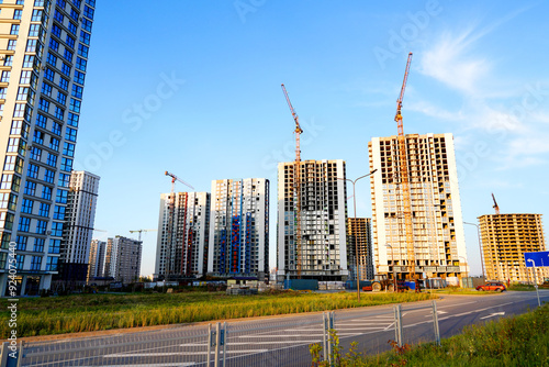 Construction site in Cityscape. Residential Building under Construction. Tower Crane on formworks. House Construction. Tower Cranes on Skyscrapers Construction. Redevelopment urban areas in city.