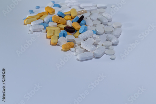 Colorful pills on white background, motion blur and focused pills.