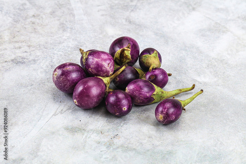 Small organic young purple round eggplant photo