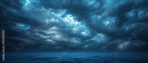 Serene Twilight Sky with Deep Blue Tones and Glowing Clouds