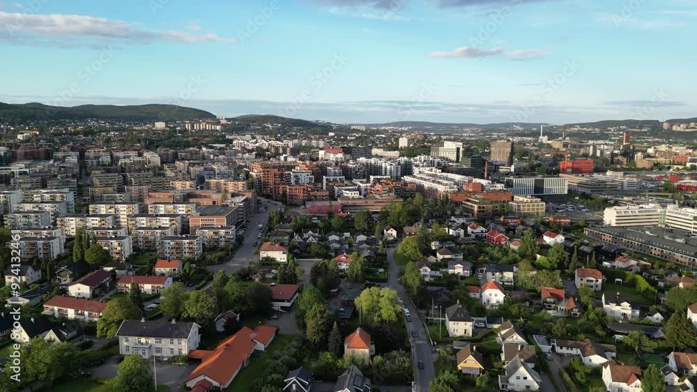 Drone video over Hasle, Oslo, with Løren in the background, one area with many new buildings, mostly housing