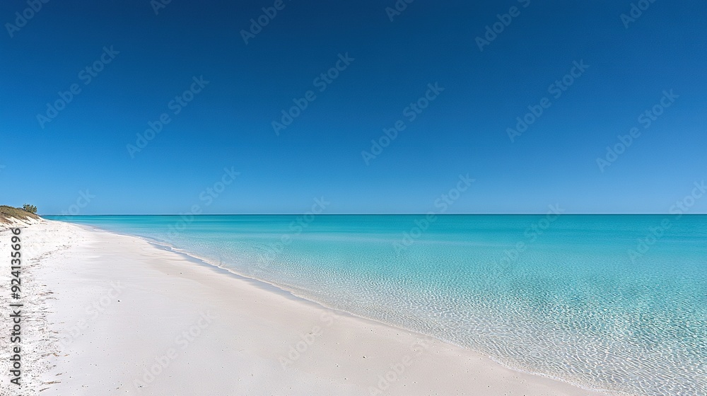 A serene beach boasts crystal-clear turquoise water and pristine white sand, with a picturesque boat anchored in the distance under a radiant sun A serene beach boasts crystal-clear turquoise water and pristine white sand, with a picturesque boat anchored in the distance under a radiant sun