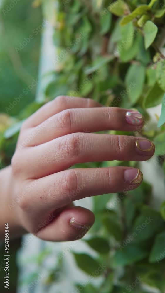 Girl showing her new nails with beautiful manicure in nature Girl showing her new nails with beautiful manicure in nature