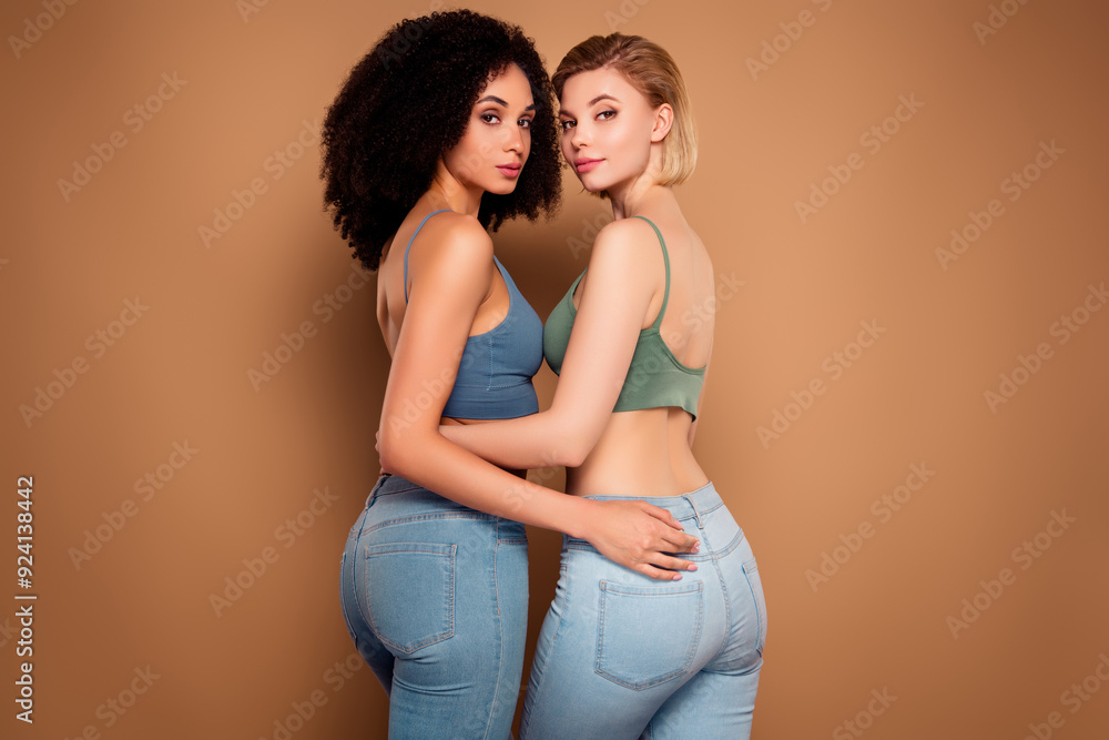 Photo of seductive sexy ladies dressed underwear top cuddling loving body positive isolated beige color background Photo of seductive sexy ladies dressed underwear top cuddling loving body positive isolated beige color background