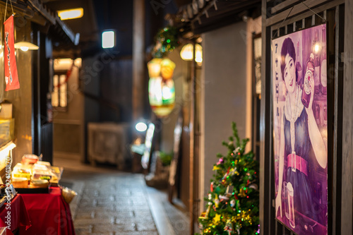 Takimi Koji, Cozy Alleyway with Vintage Poster in Osaka photo