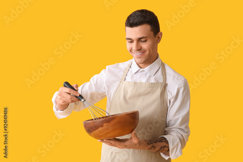 Handsome happy male chef wi...