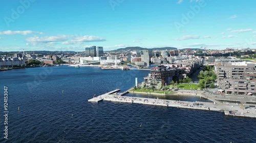 Oslo city center seen from Sørenga in Oslofjorden with Bjørvika bay, the opera house and Munch art gallery photo