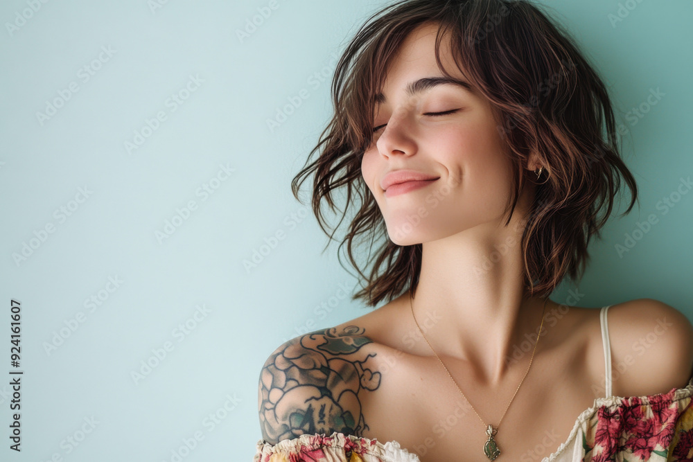 A close up of a woman's face with tattoos and her eyes closed A close up of a woman's face with tattoos and her eyes closed