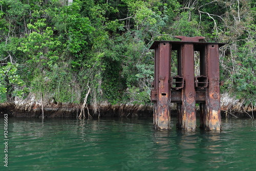 Rusty pylon-mooring for vessels exporting the precious woods extracted from 1930-45 in the Bahia Taco Bay area by a US-owned sawmill. Baracoa-Cuba-604 photo