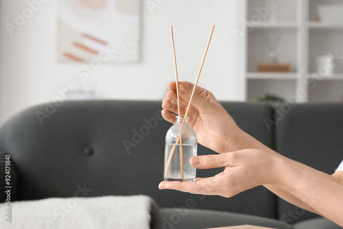 Female hands with aroma dif...