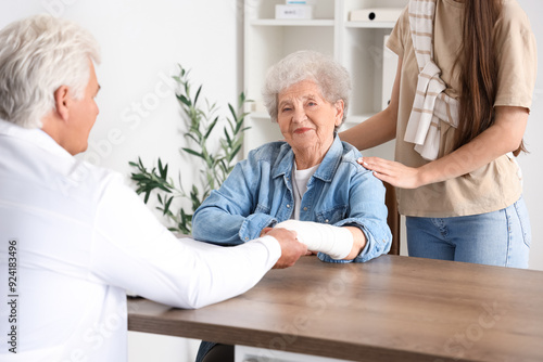 Senior woman with bandaged ...
