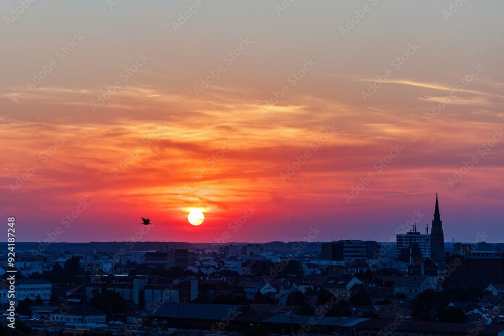 Fototapeta premium Sunset over Osijek, Croatia with vibrant colors illuminating the skyline
