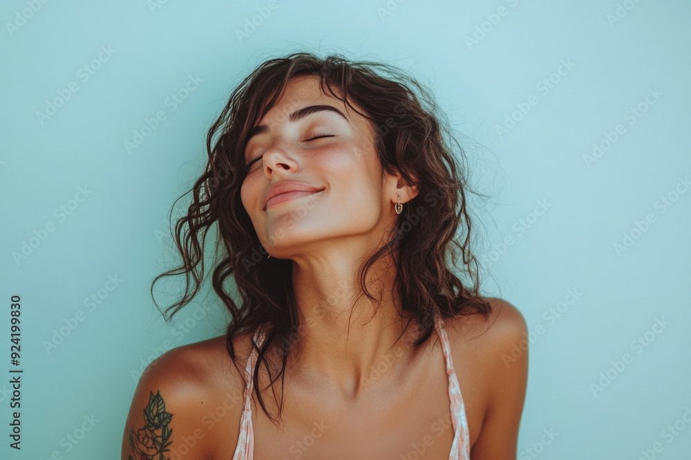A close up of a woman's face with tattoos and her eyes closed A close up of a woman's face with tattoos and her eyes closed