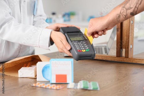 Female pharmacist receiving...
