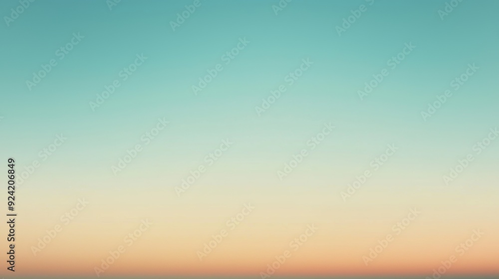 Fototapeta premium Turquoise blue sky softly fading into warm orange and yellow color at the horizon. Perfect background for summer and travel designs