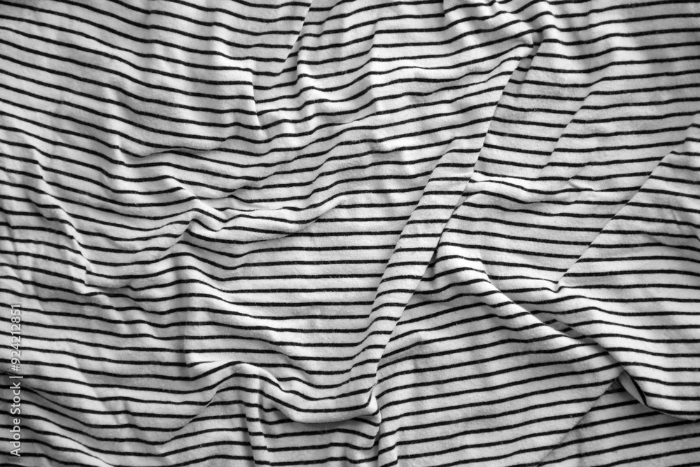 Processed collage of abstract black and white stripped cloth background with many folds Processed collage of abstract black and white stripped cloth background with many folds