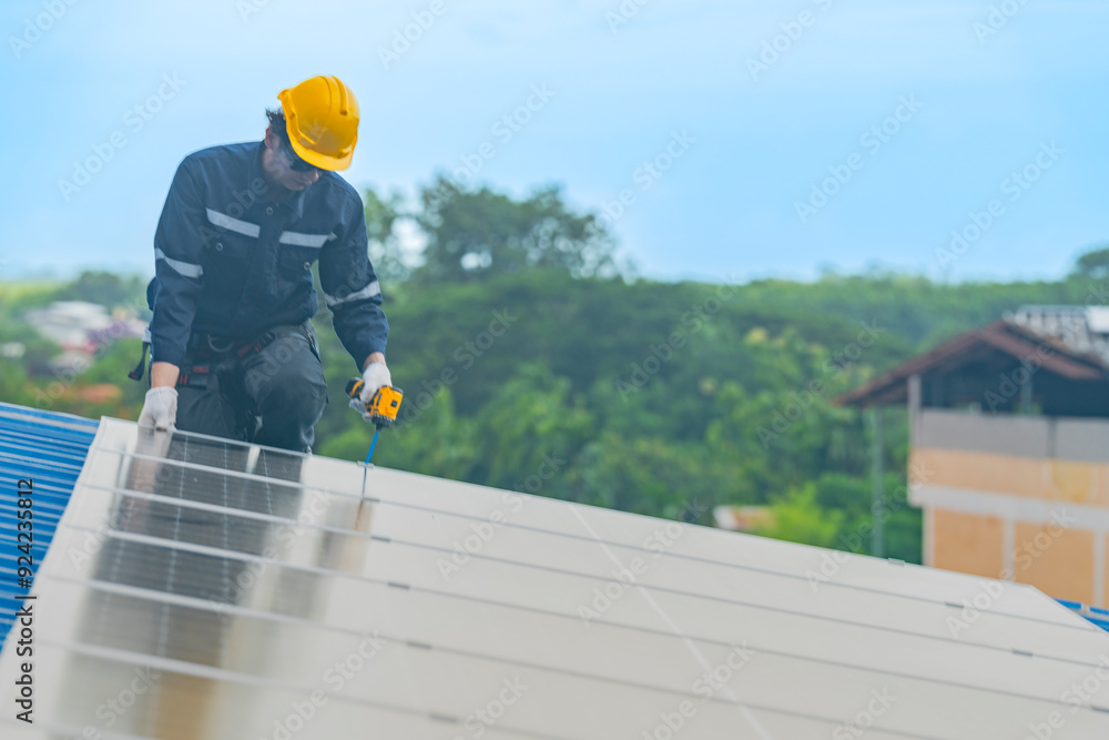 custom made wallpaper toronto digitalengineer man inspects construction of solar cell panel or photovoltaic cell by electronic device. Industrial Renewable energy of green power. factory worker working on tower roof.