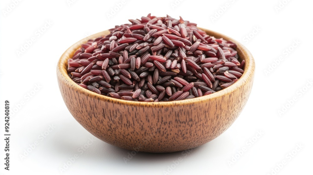 A bowl filled with cooked Riceberry rice, isolated on a white background. The striking color and texture of the rice stand out against the white backdrop. A bowl filled with cooked Riceberry rice, isolated on a white background. The striking color and texture of the rice stand out against the white backdrop.
