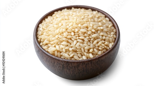 Close-up of a bowl filled with uncooked Jasmine rice grains, isolated on a white background with a clipping path. Minimalistic and clean food concept.