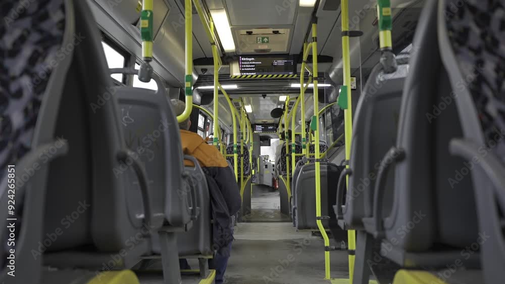 Germany, Berlin. Municipal bus BVG, Berliner Verkehrsbetriebe view from inside from passenger seat. Interior of yellow city bus on route in Berlin. Public transportation in Germany. Germany, Berlin. Municipal bus BVG, Berliner Verkehrsbetriebe view from inside from passenger seat. Interior of yellow city bus on route in Berlin. Public transportation in Germany.