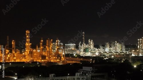 Wallpaper Mural High angle view of industrial plant with pipes and tanks for mixing chemicals and gases at night. Torontodigital.ca