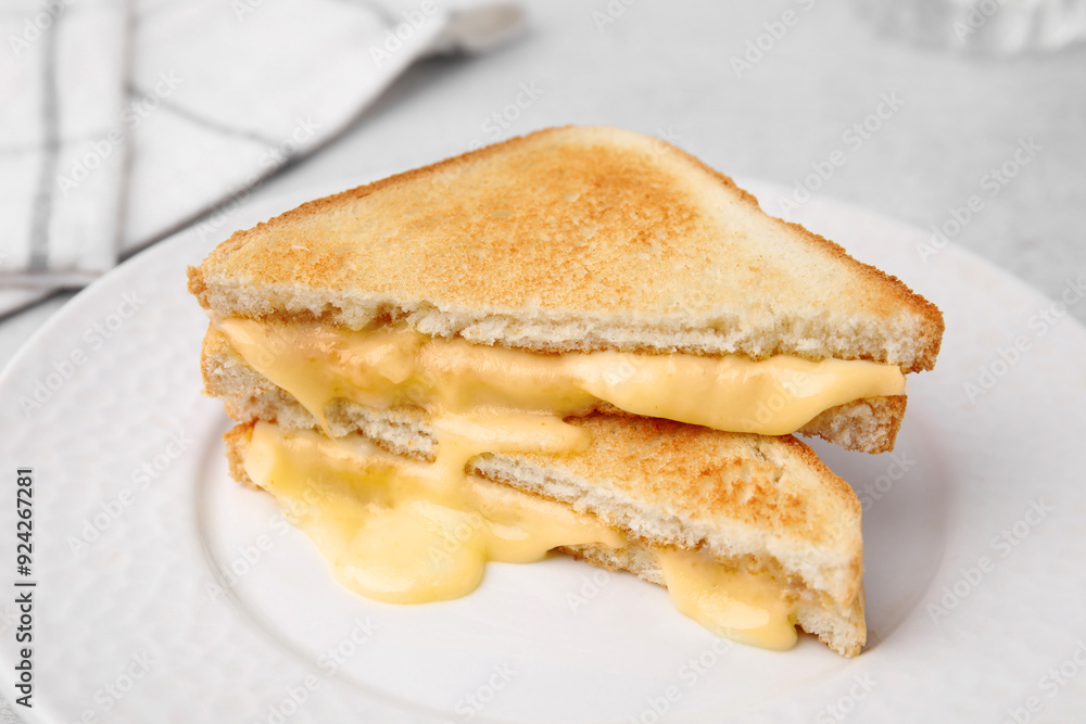 Pieces of toasted bread with melted cheese on table, closeup Pieces of toasted bread with melted cheese on table, closeup
