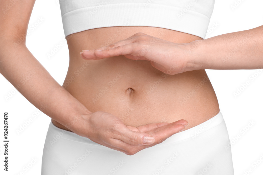 Healthy digestion. Woman holding something near her belly on white background, closeup Healthy digestion. Woman holding something near her belly on white background, closeup
