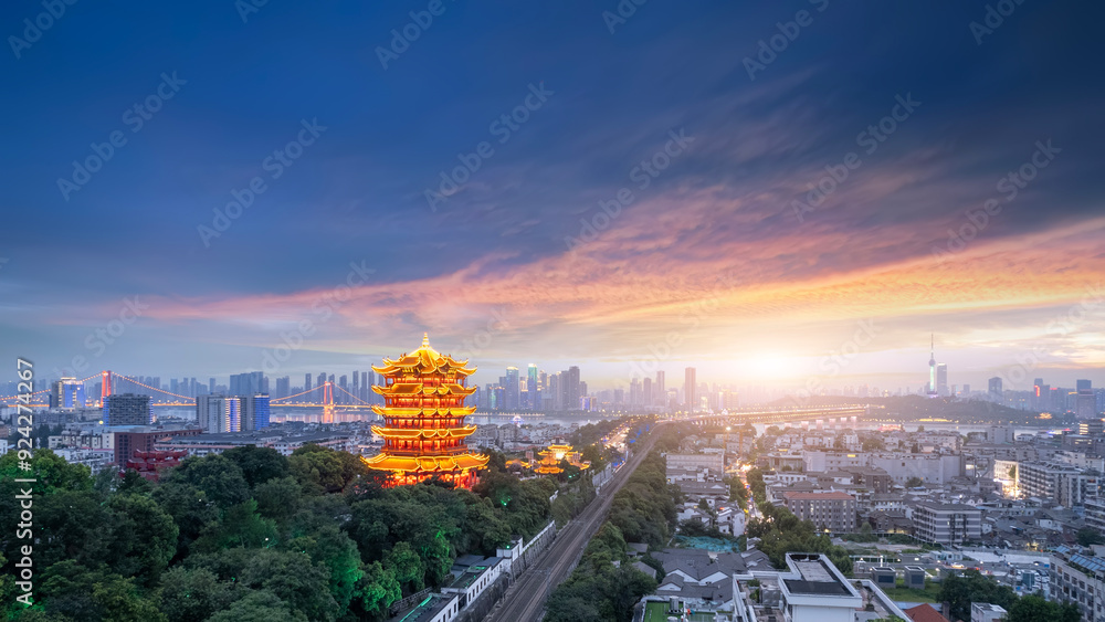 Fototapeta premium Majestic Sunset Over Urban Landscape Featuring Traditional Pavilion