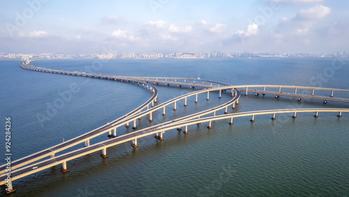 Wallpaper Mural Aerial View of a Curving Bridge Stretching Over Tranquil Waters Torontodigital.ca