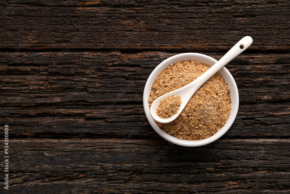 Soy fiber based powdered food in the bowl and spoon Soy fiber based powdered food in the bowl and spoon