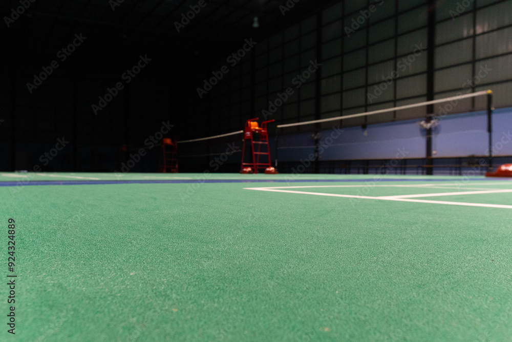 Fototapeta premium Bilton batting court net indoor stadium green badminton court Used for exercise and competition.