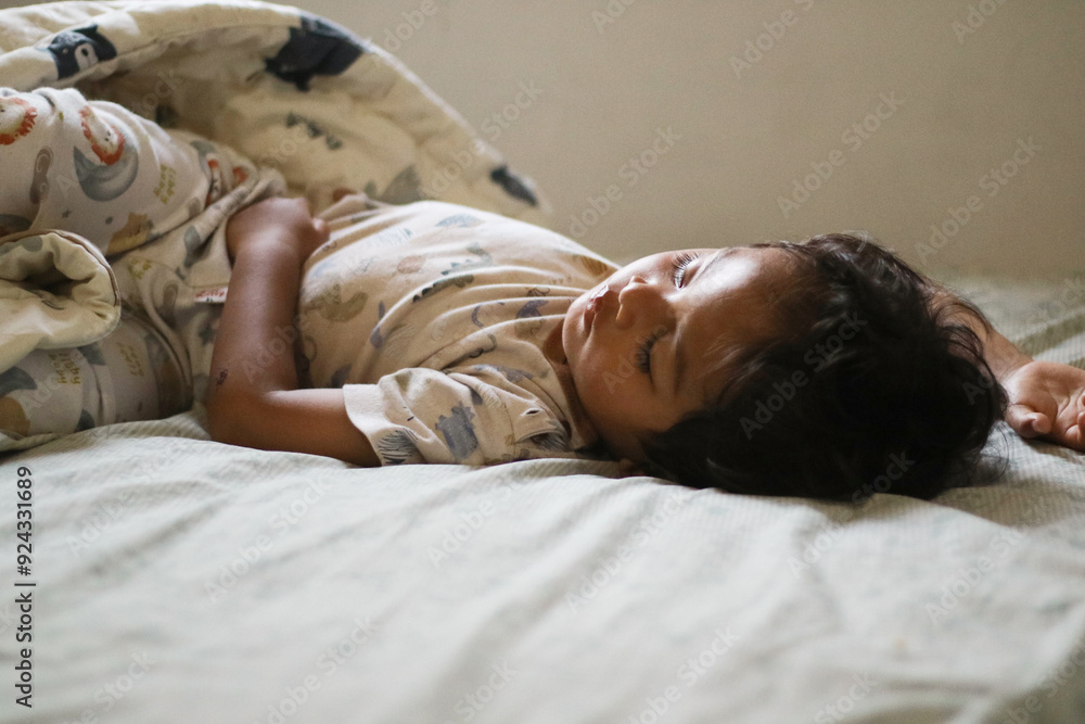 Adorable cute toddler or baby boy sleeping on bed at morning with sweet dream in bedroom Lovely child get deep sleep and get relax and happy during lying down on bed Little infant boy get good sleep Adorable cute toddler or baby boy sleeping on bed at morning with sweet dream in bedroom Lovely child get deep sleep and get relax and happy during lying down on bed Little infant boy get good sleep
