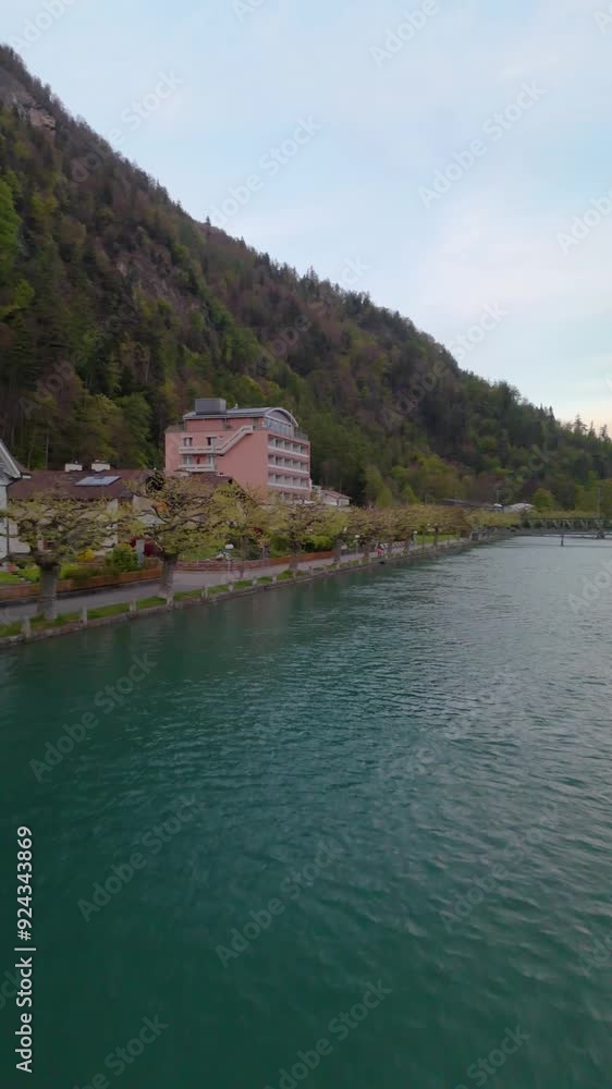 Aar river Interlaken Switzerland alps drone aerial side reveal cloudy day Vertical Aar river Interlaken Switzerland alps drone aerial side reveal cloudy day Vertical