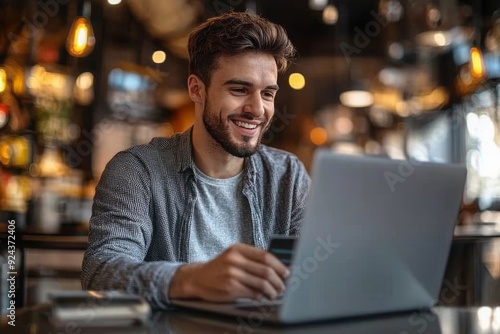 Happy smiling man buying, shopping or paying online with bank card and laptop, Generative AI