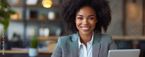 Young African American business manager using cell phone mobile app, laptop. Latin smiling adult businesswoman in suit holding smartphone sitting at office table, working online. Generative AI photo