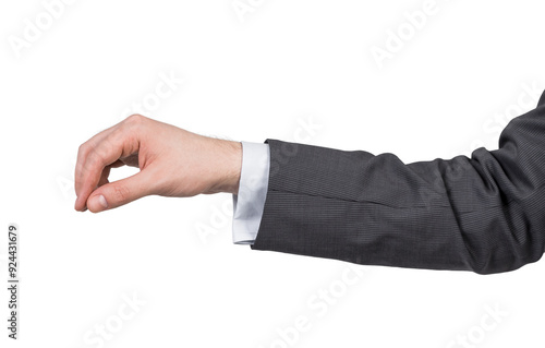 Foto The image shows a person's hand in a suit making a pinching gesture