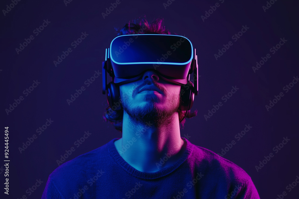 man wearing a virtual reality headset is standing in a dark room. The room is illuminated with neon lights, creating a futuristic and immersive atmosphere man wearing a virtual reality headset is standing in a dark room. The room is illuminated with neon lights, creating a futuristic and immersive atmosphere