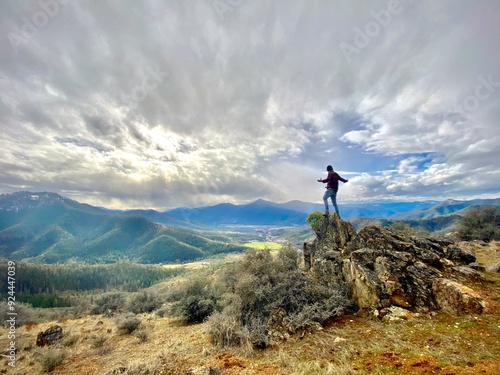 person in the mountains admiring the view