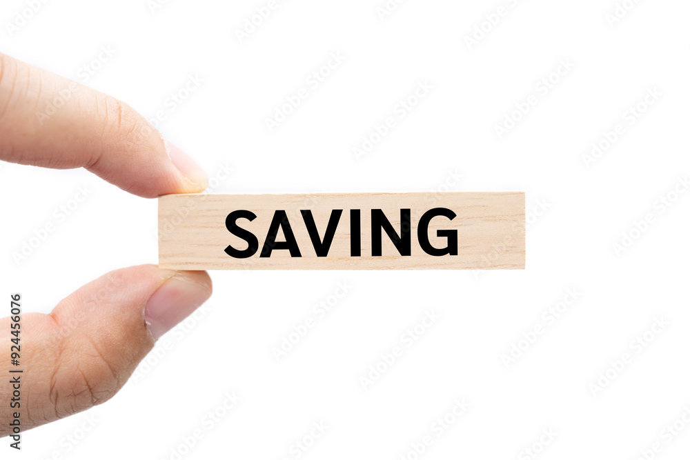 Text SAVING on wooden block with piggy bank on the background. Financial and business concept. retirement saving concept. money saving for rainy day. isolated on white background and clipping path. Text SAVING on wooden block with piggy bank on the background. Financial and business concept. retirement saving concept. money saving for rainy day. isolated on white background and clipping path.