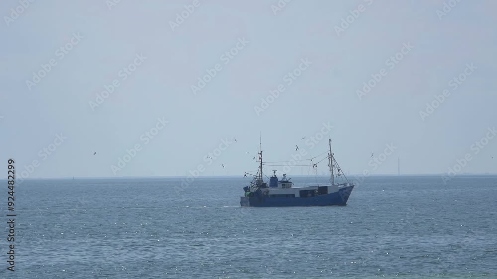 Fishing boat sailing on the open sea under clear skies in 4k Fishing boat sailing on the open sea under clear skies in 4k